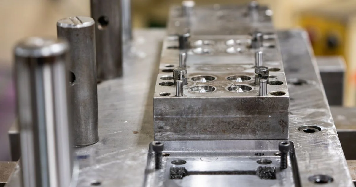 Precision metal stamping die and tooling assembly